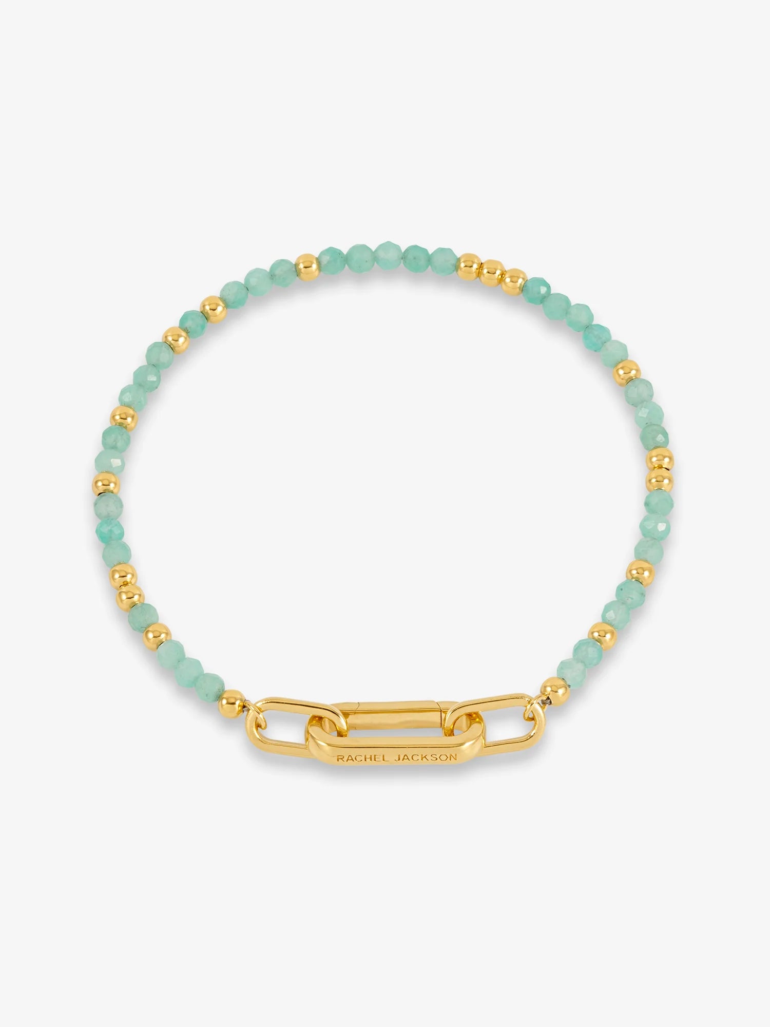 Bracelet with green beads and gold clasp on a white background
