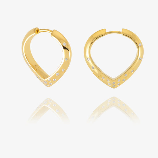 Gold hoop earrings with small diamonds on a white background