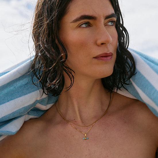 Lady wearing gold Rachel Jackson Necklaces outdoors