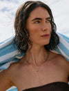 Lady wearing gold Rachel Jackson Necklaces outdoors