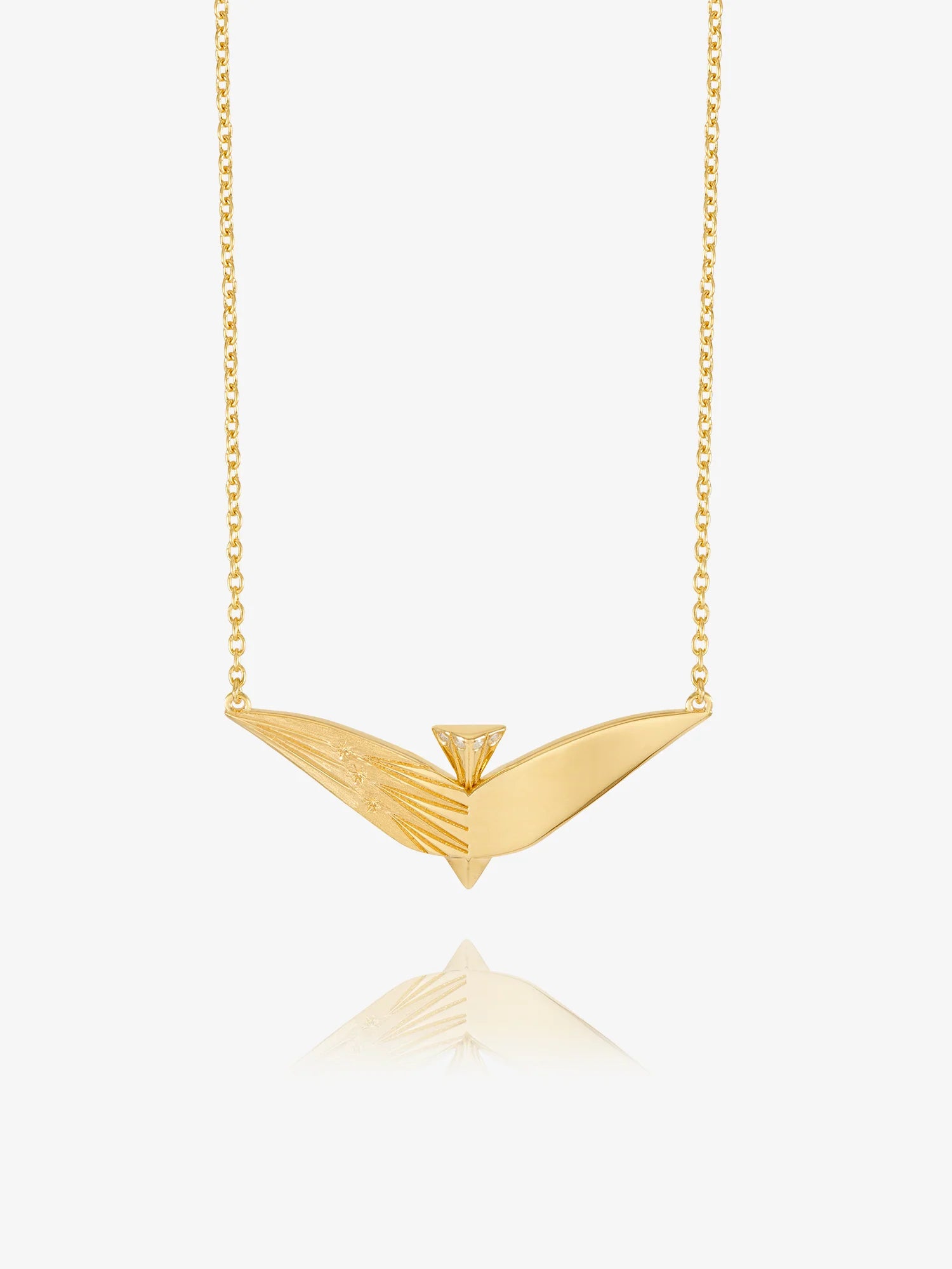 Gold necklace with a unique pendant on a white background