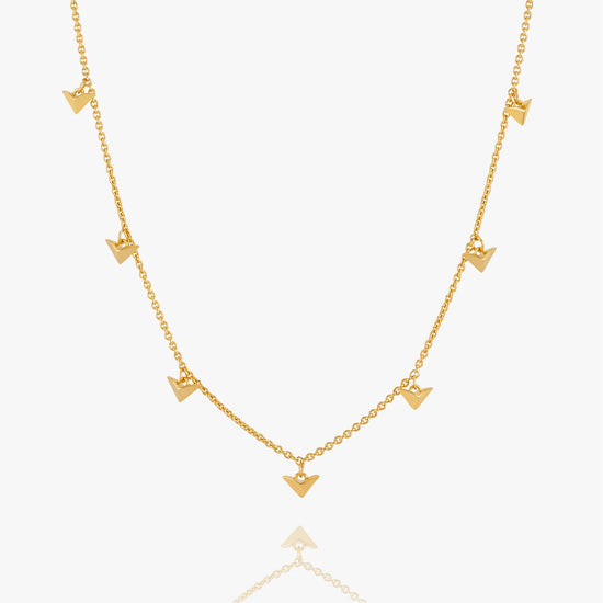 Gold necklace with bird-shaped pendants on a white background