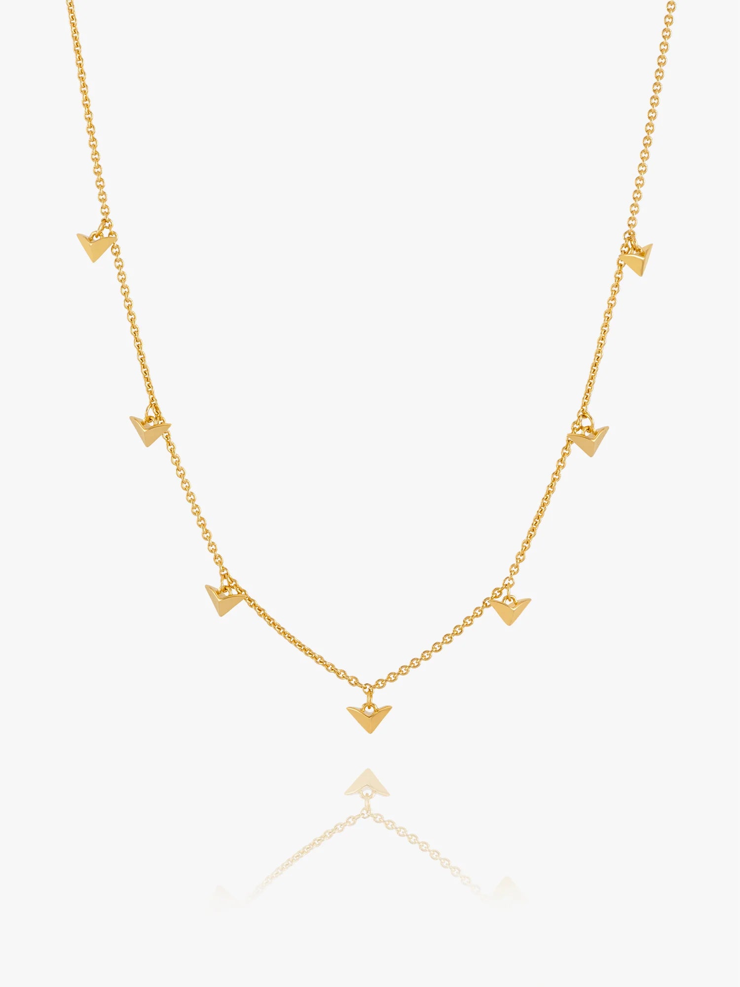Gold necklace with bird-shaped pendants on a white background