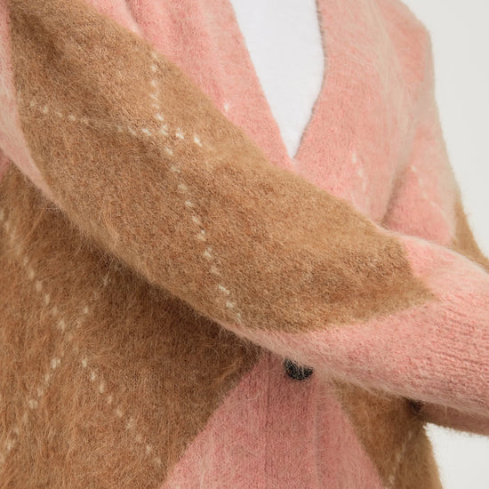 pastel pink argyle cardigan close up