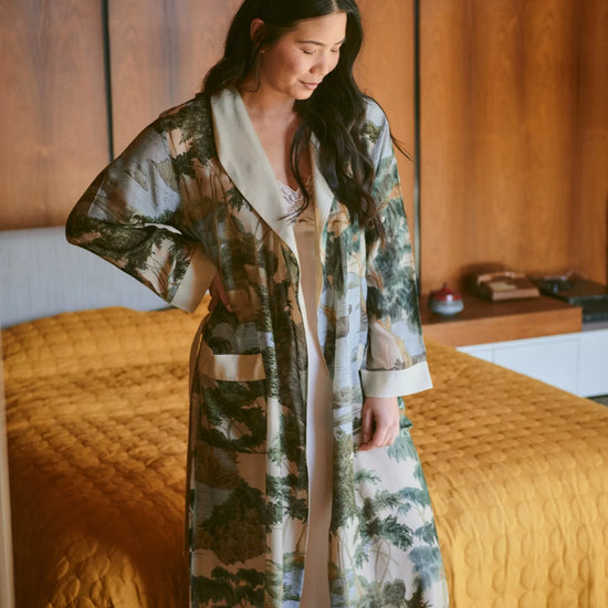 dressing gown with beige lapels/edging and green/blue tree and rivers print from one hundred stars model shot