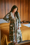 dressing gown with beige lapels/edging and green/blue tree and rivers print from one hundred stars model shot