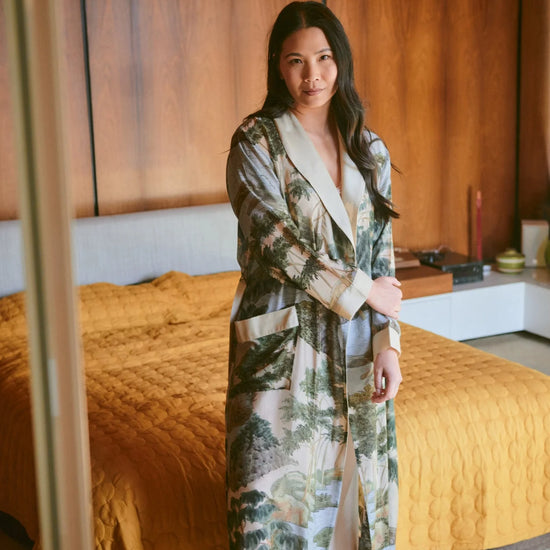 dressing gown with beige lapels/edging and green/blue tree and rivers print from one hundred stars model shot