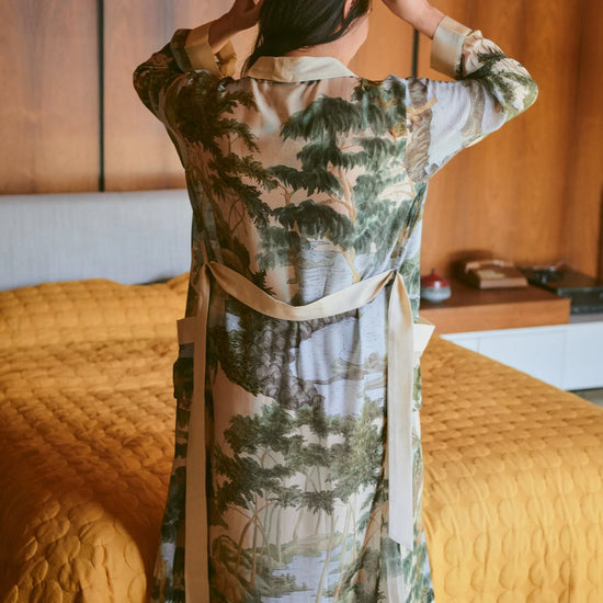 dressing gown with beige lapels/edging and green/blue tree and rivers print from one hundred stars rear view