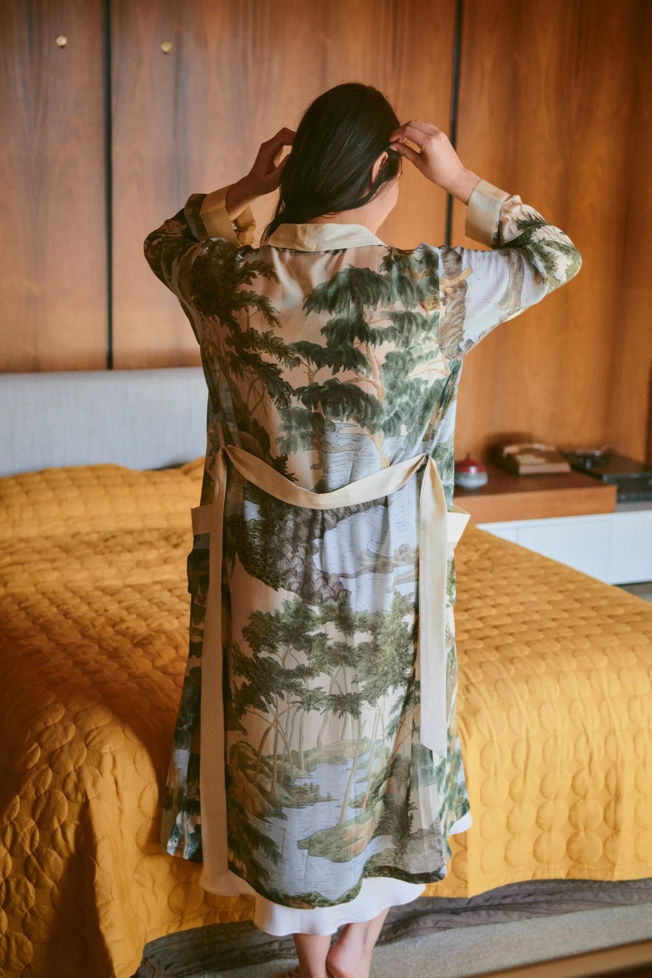 dressing gown with beige lapels/edging and green/blue tree and rivers print from one hundred stars rear view