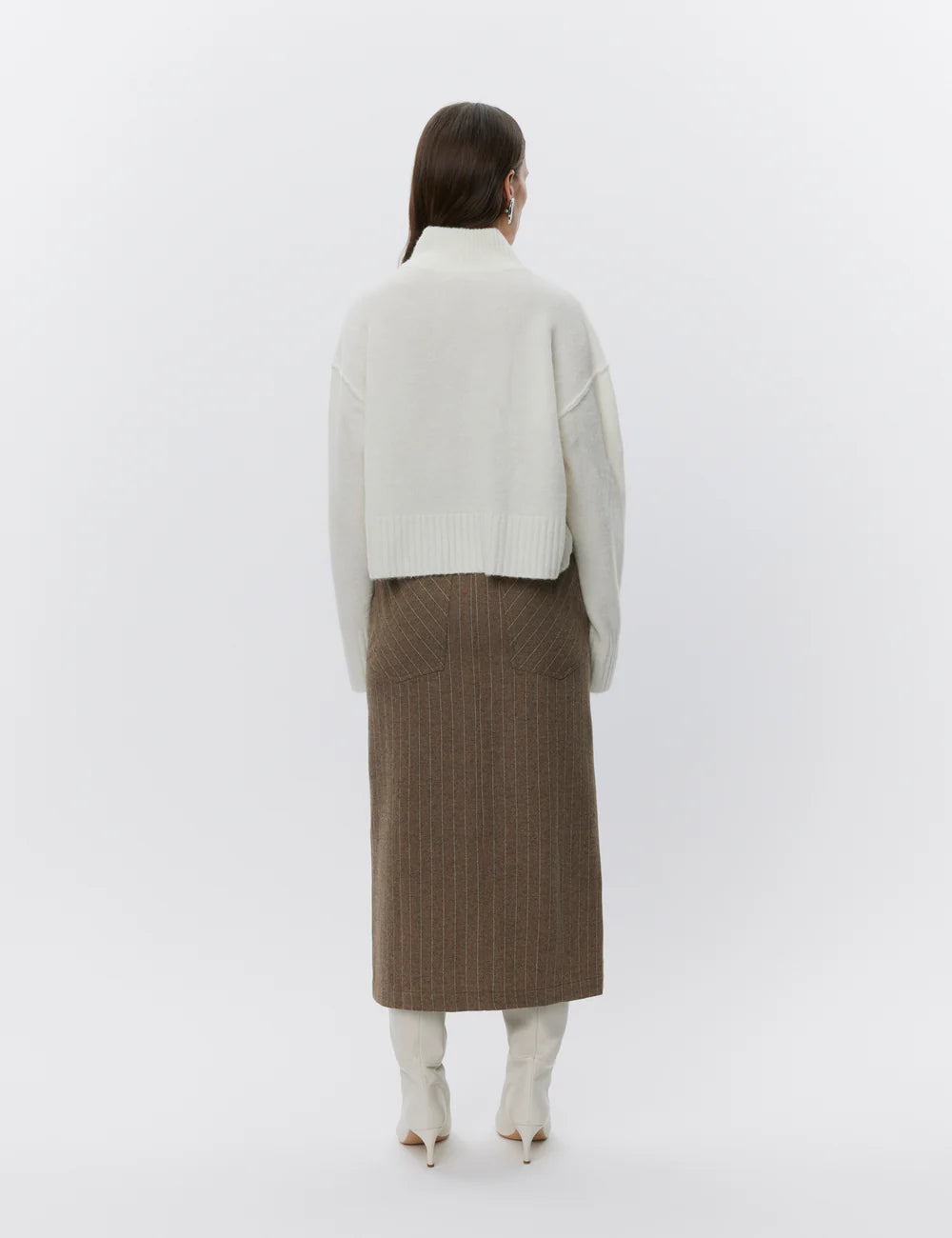 Rear view of Turtle neck long sleeved crop alpaca and wool blend knit