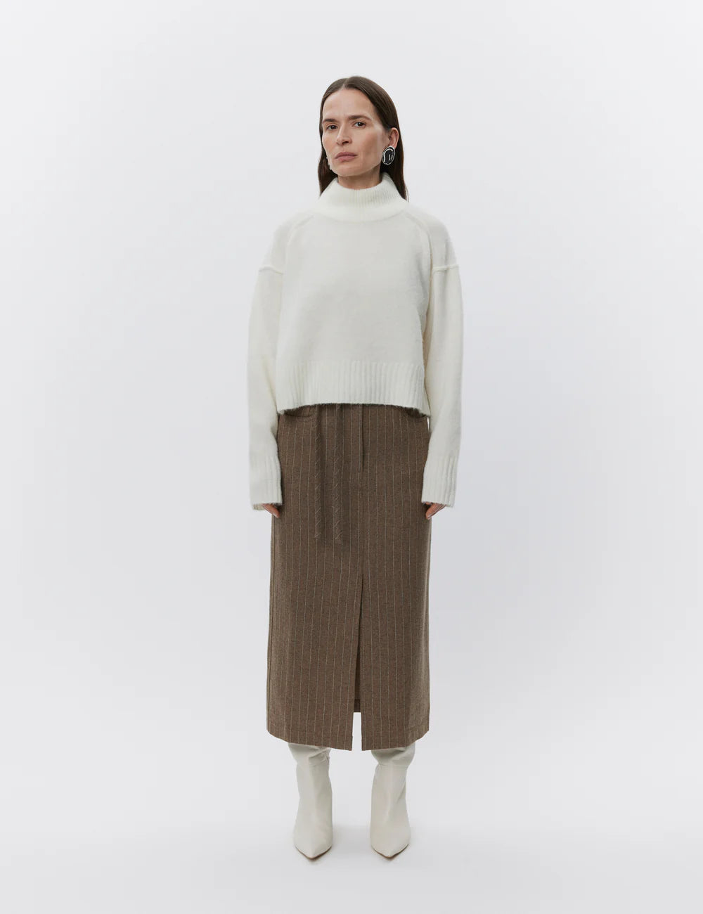 Turtle neck long sleeved crop alpaca and wool blend knit worn with straight skirt