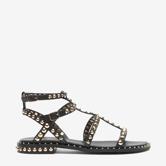 Black sandal with gold studs on a white background side view