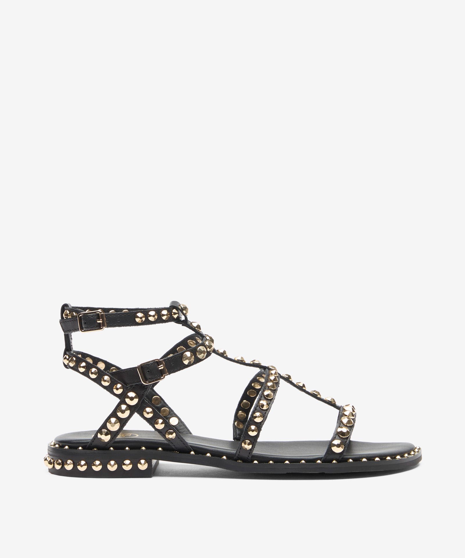 Black sandal with gold studs on a white background side view