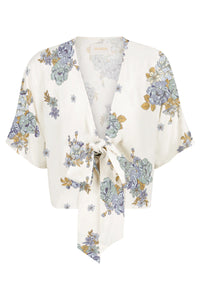 Cream and floral tie top with short sleeves and a tie feature which fastens the front at the base of the v neck boxy fit