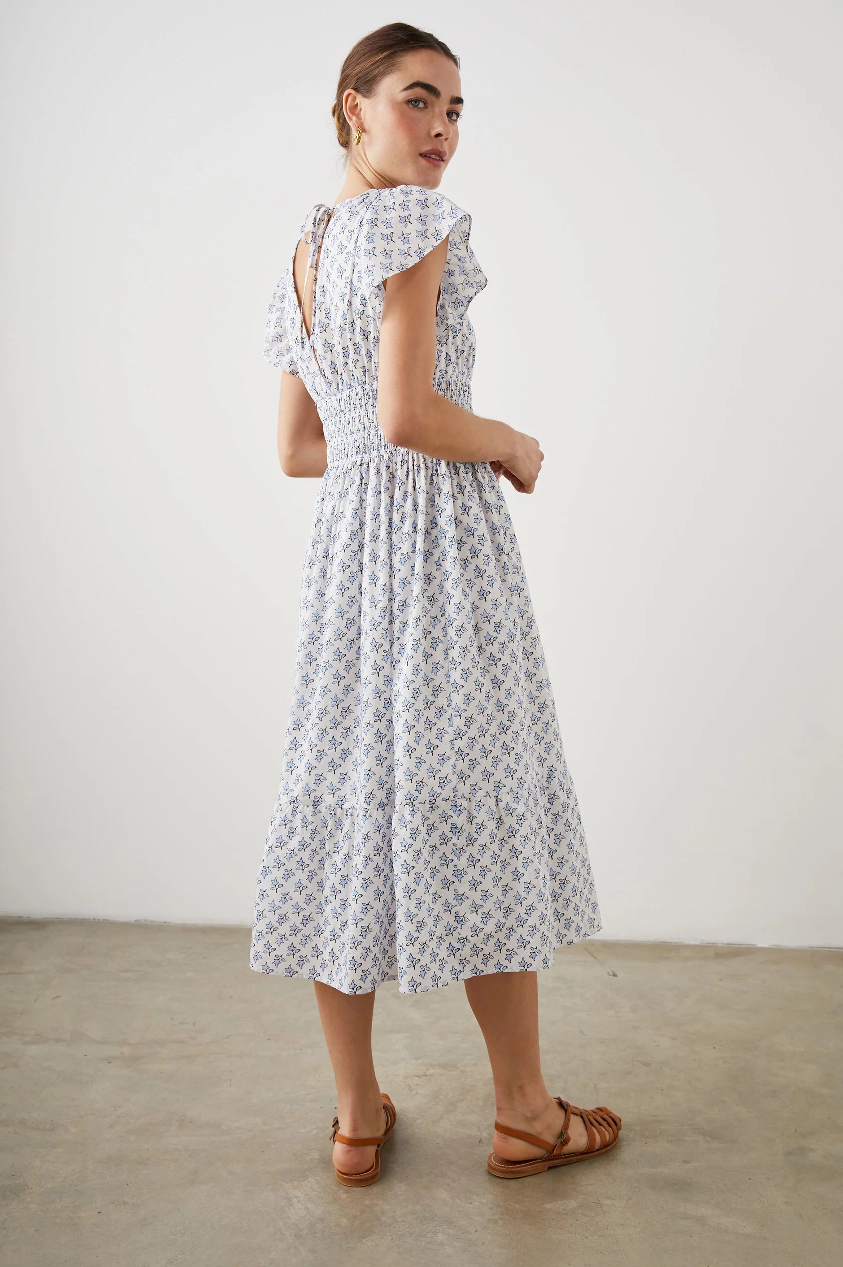 White and ditsy floral V neck and backline midi dress with capped frill sleeves and double tiered lined skirt