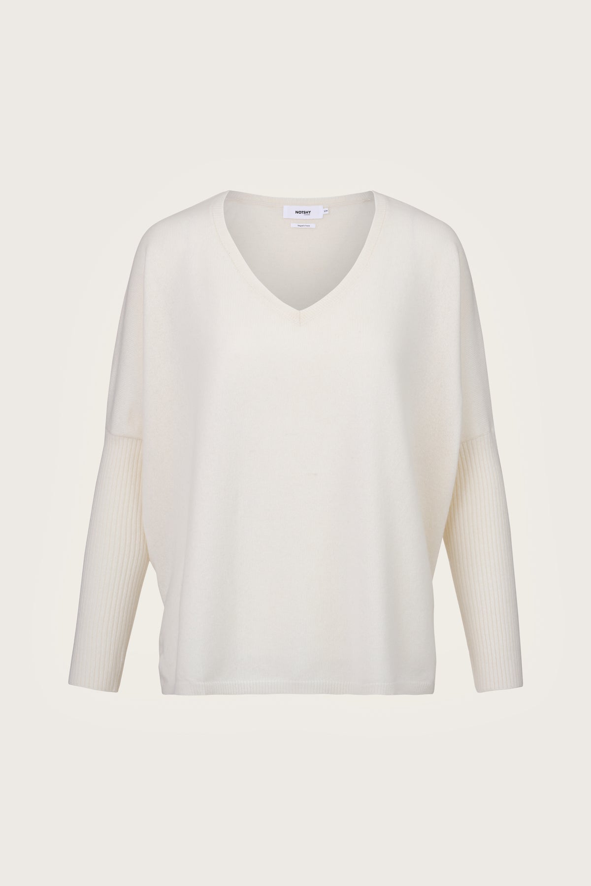 Winter white v neck jumper with dropped shoulders and tight sleeves
