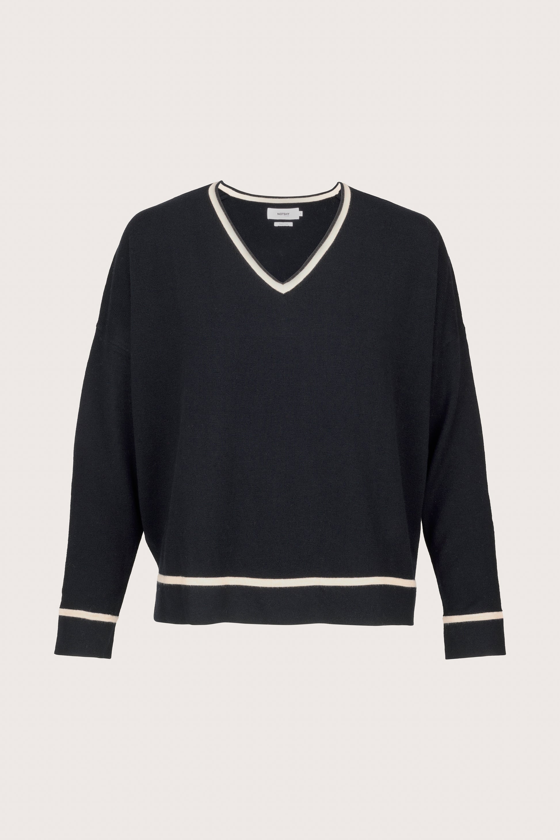 black v-neck jumper with beige piping on neck, cuffs and hem with relaxed fit 