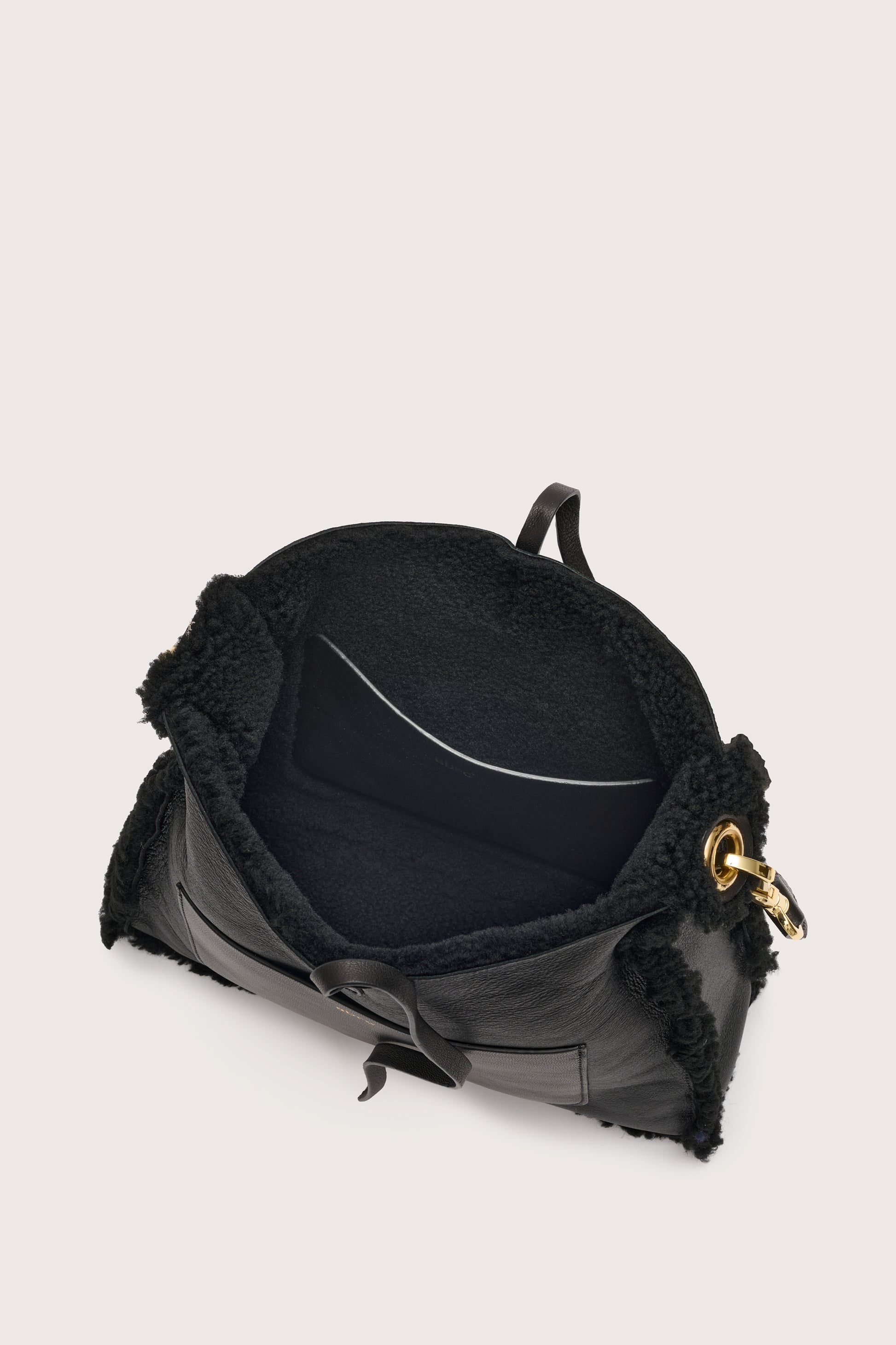 Internal view of black shearling bag