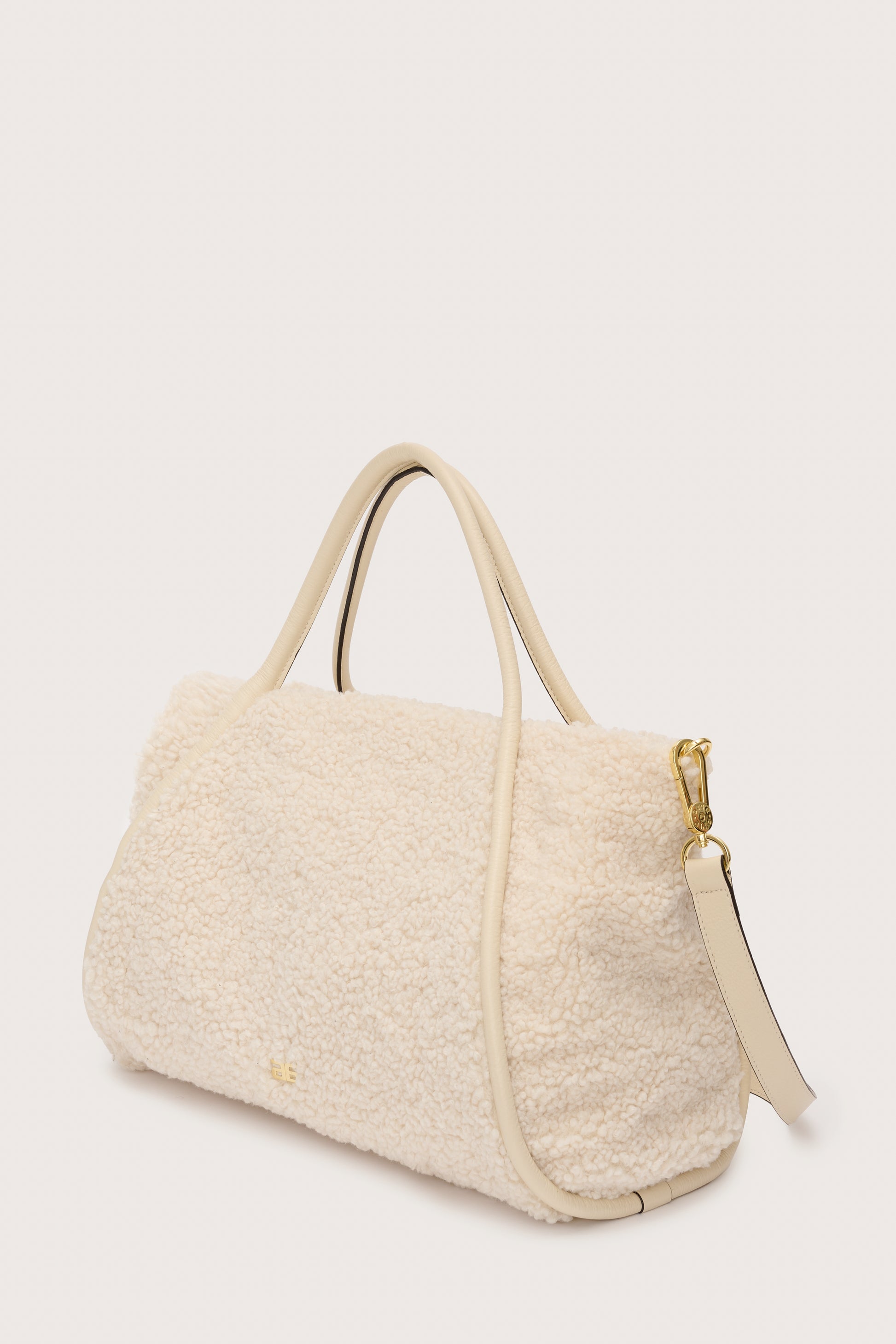 Side view of faux shearling bag