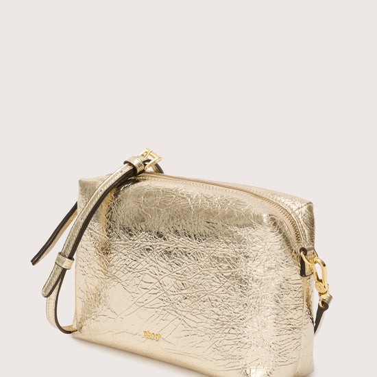 Gold gross body  leather bag