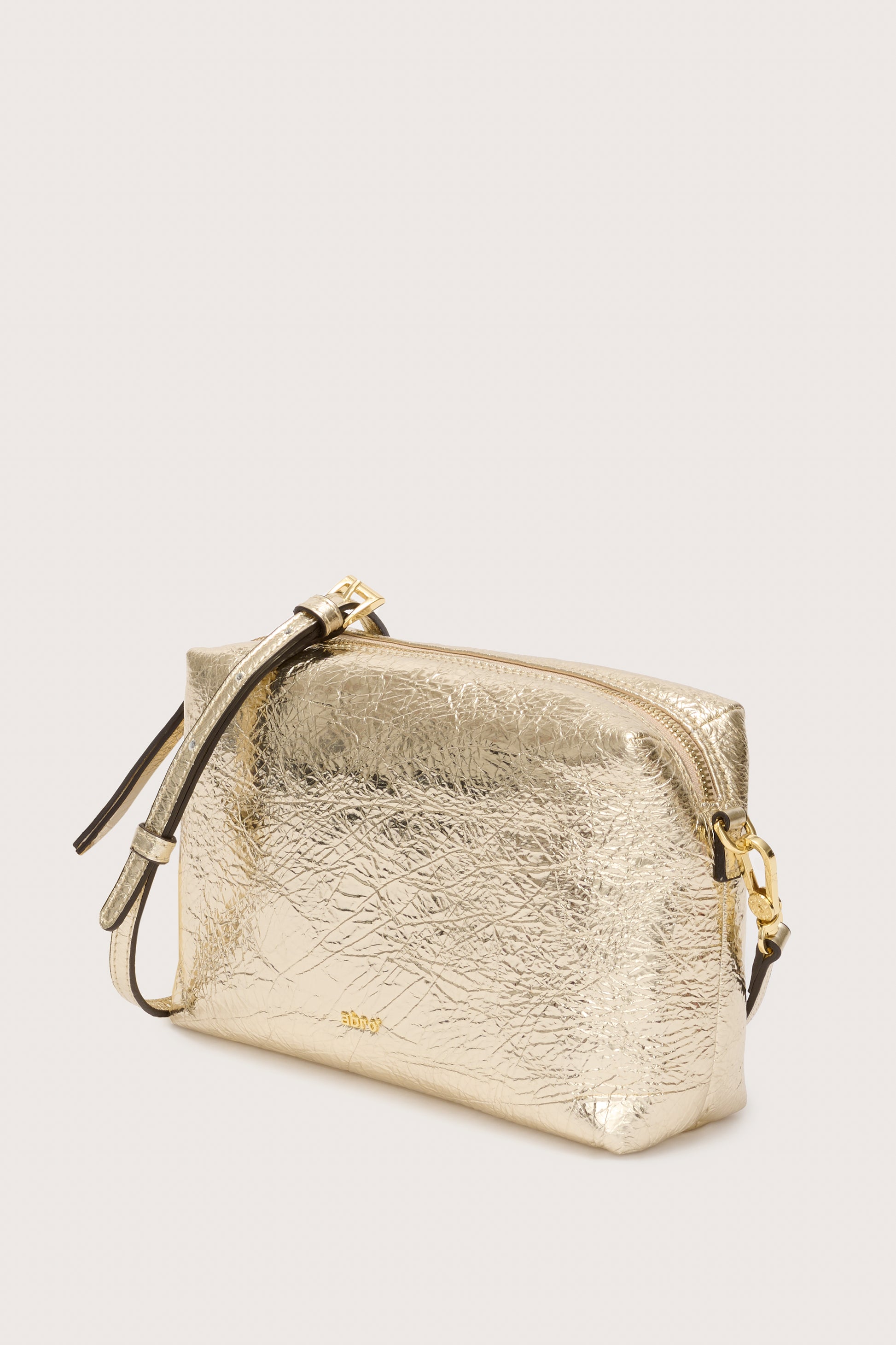 Gold gross body  leather bag