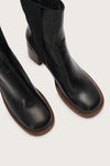 shot of the toes of the black pull on leather boot