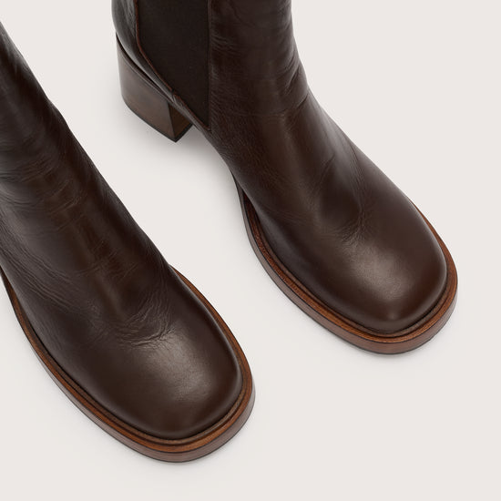 Shot of the toes of the brown leather pull on boot