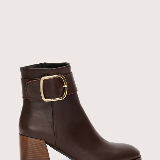 Brown leather boots with gold buckle detail 