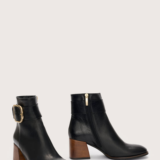 Black Italian leather boot with gold buckle at the ankle