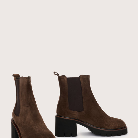 Side view of brown suede pull on boots