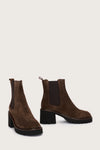 Side view of brown suede pull on boots