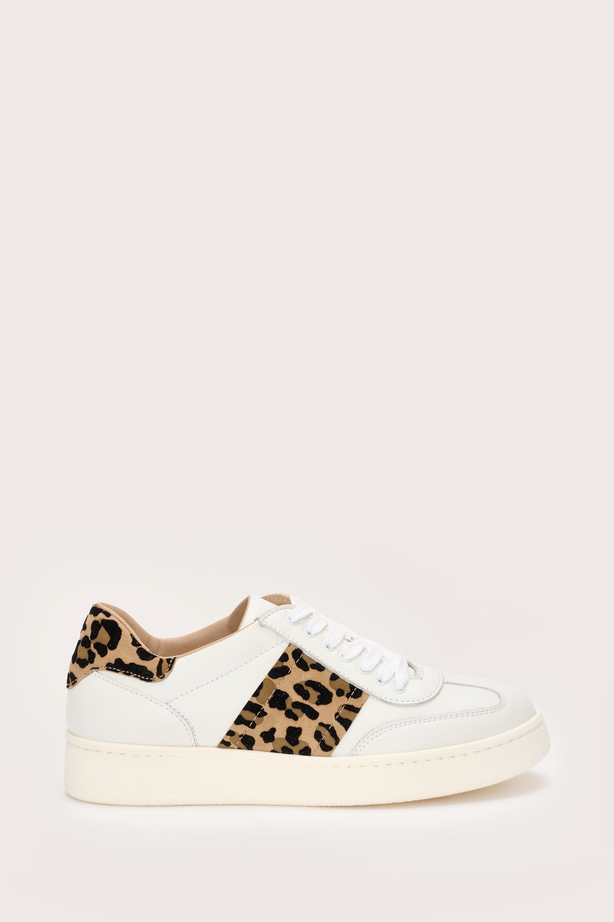 Leopard print shops and white trainers