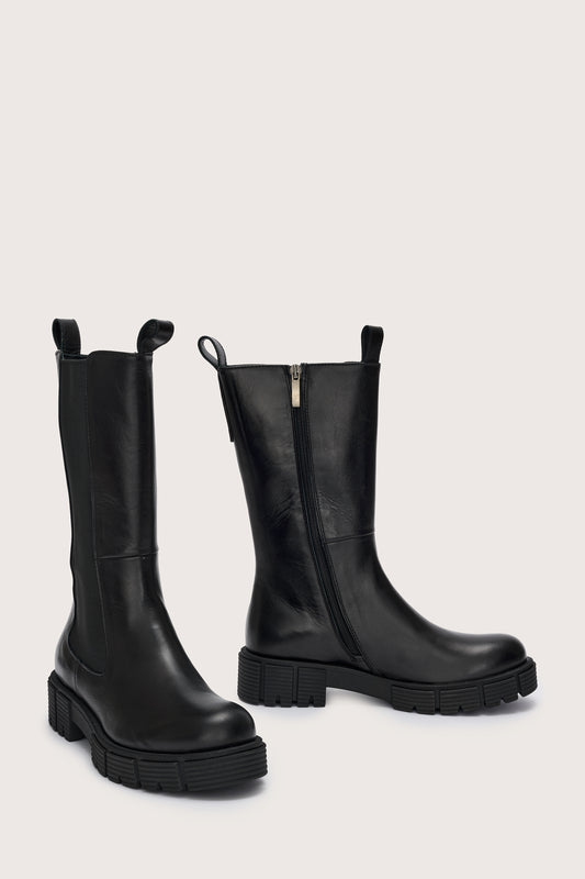 Side view of tall  black leather boots with side zip