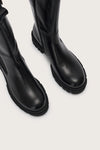 Close up of the toe of the tall black chelsea boot with side zip