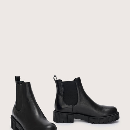 Side view of black leather chunky chelsea boot