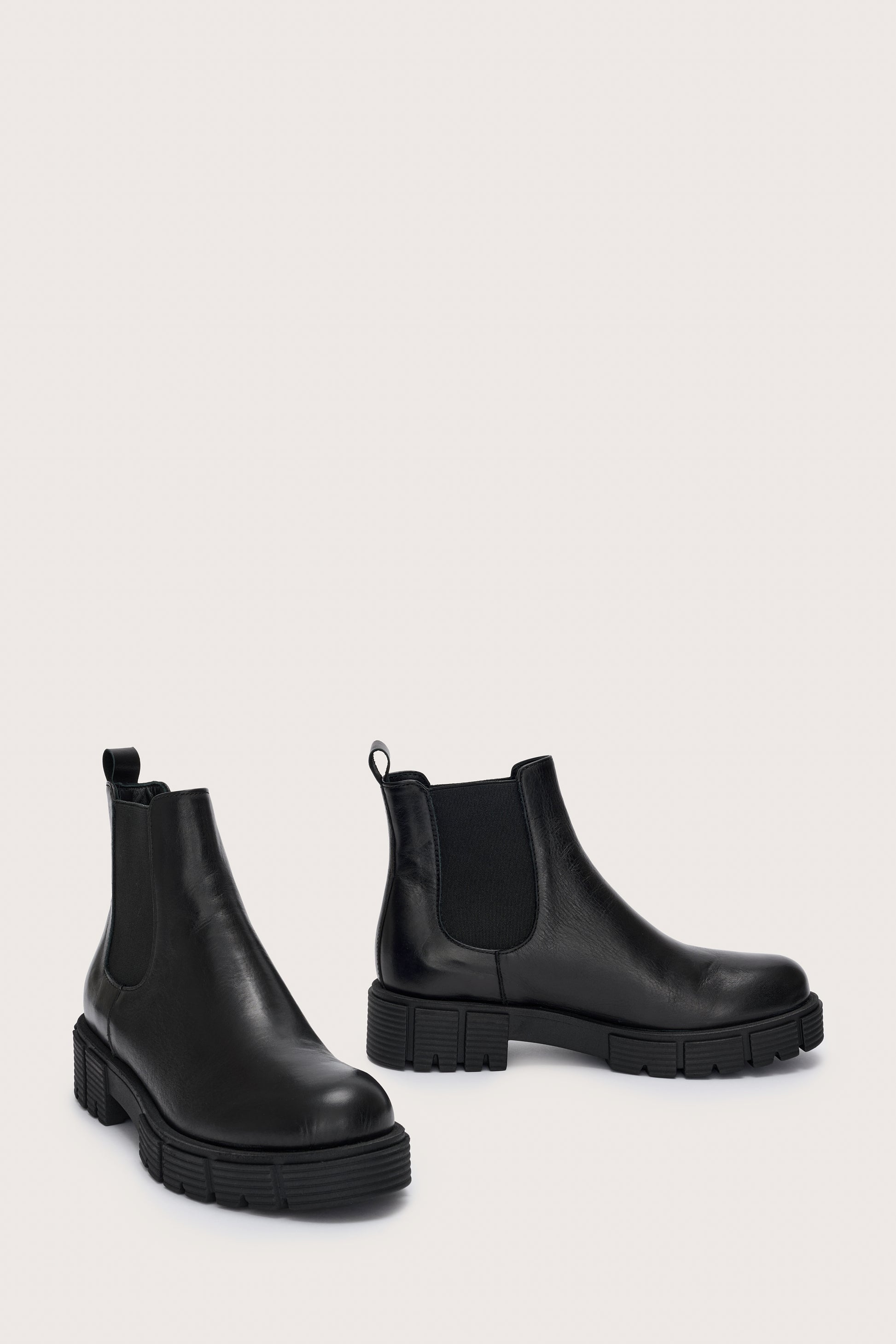 Side view of black leather chunky chelsea boot