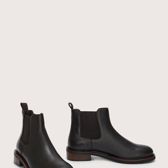 Side view of short black chelsea boot