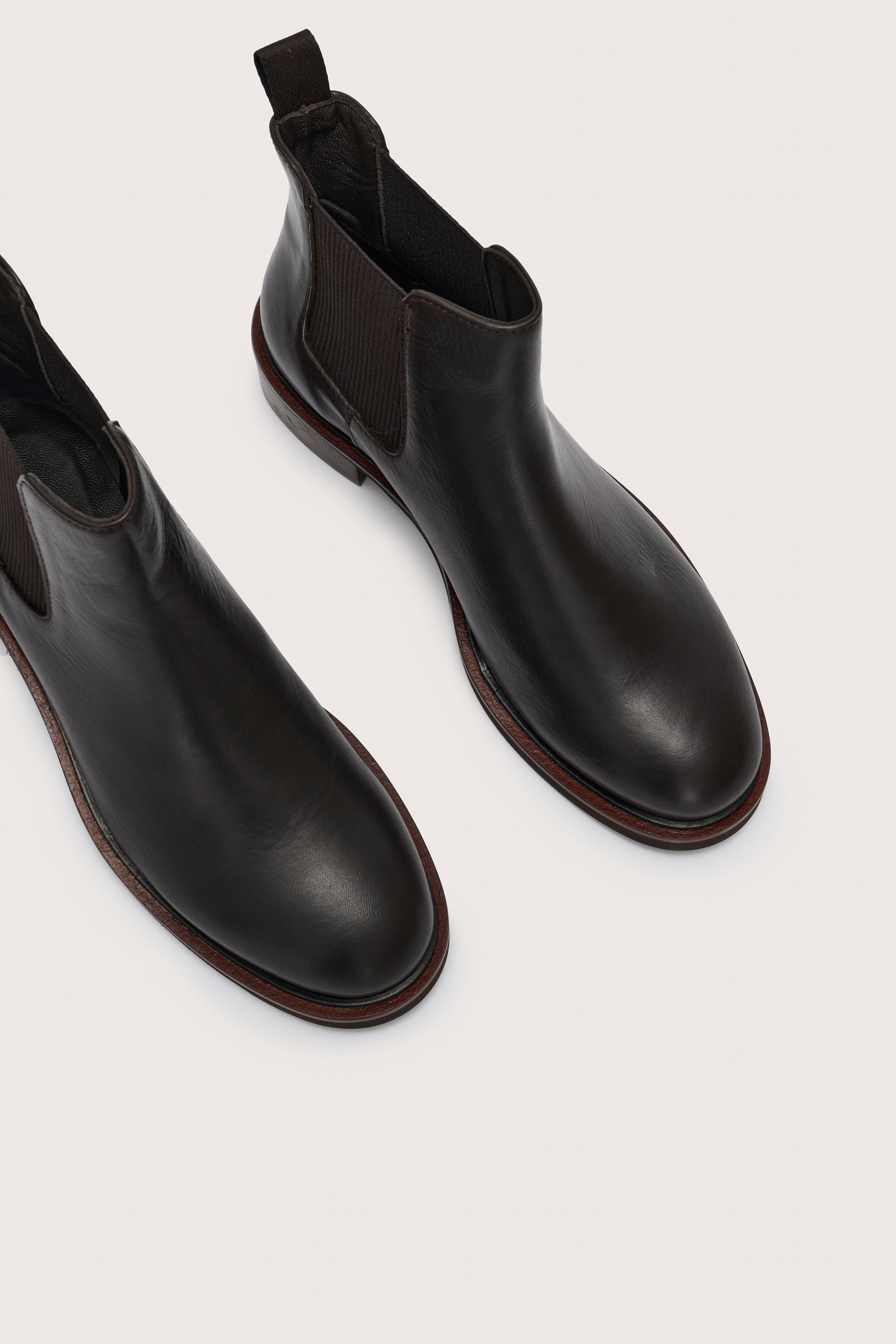 close up of toe shape of short black chelsea boot