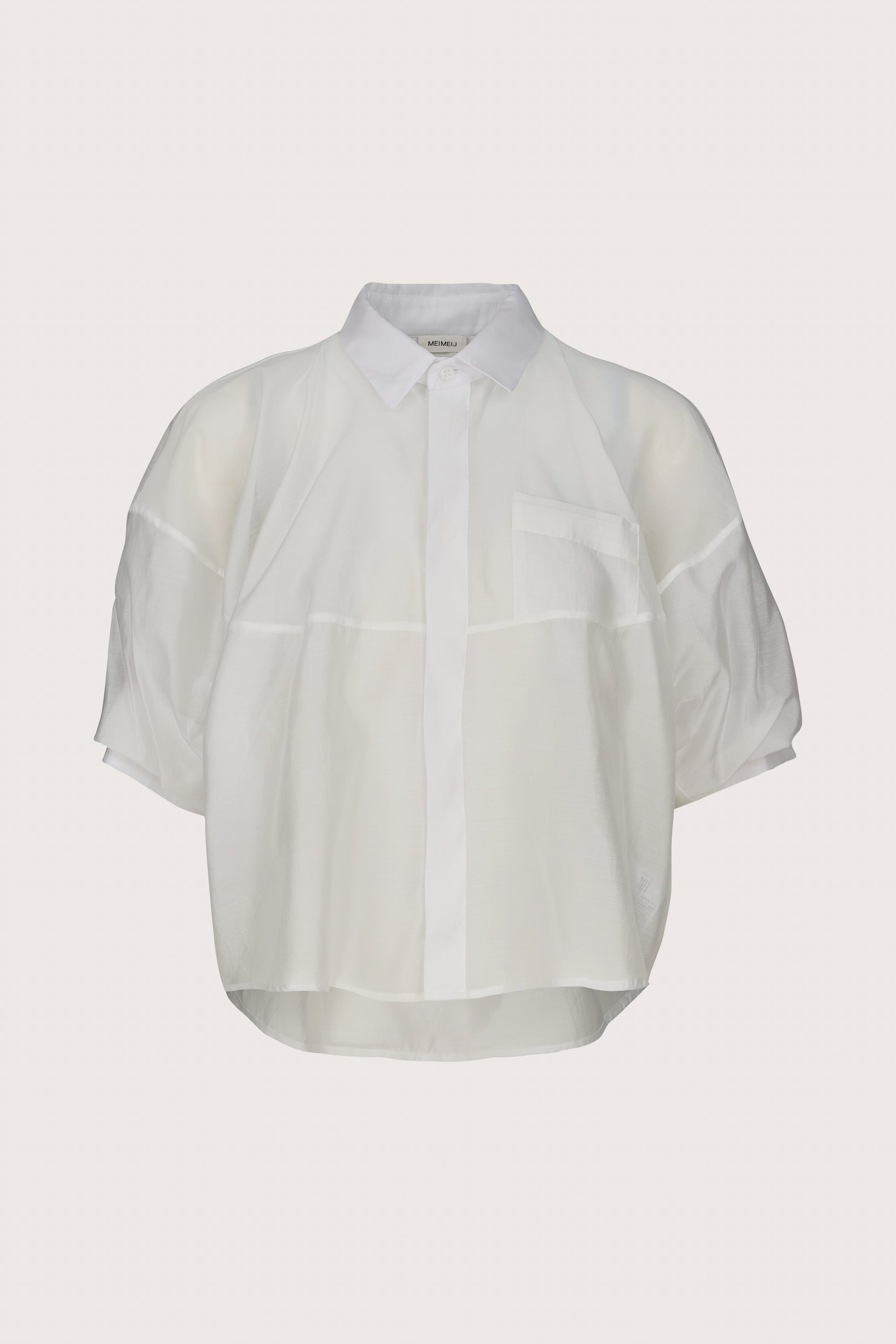 White sheer blouse on a light gray background