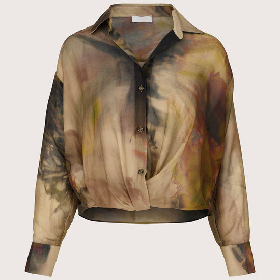 Artistic abstract patterned shirt on a light beige background