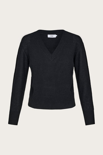 Black cashmere v neck sweater on a light gray background