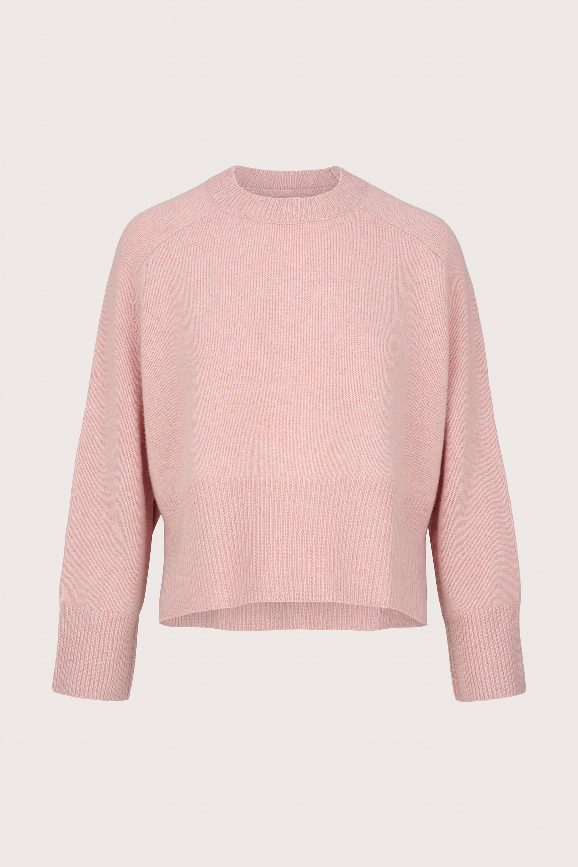 Pink cashmere sweater on a light gray background
