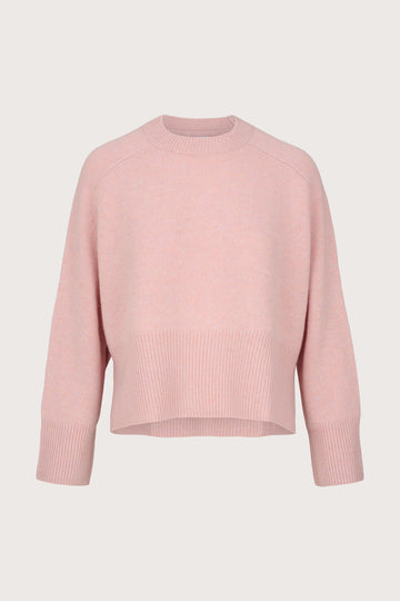 Pink cashmere sweater on a light gray background
