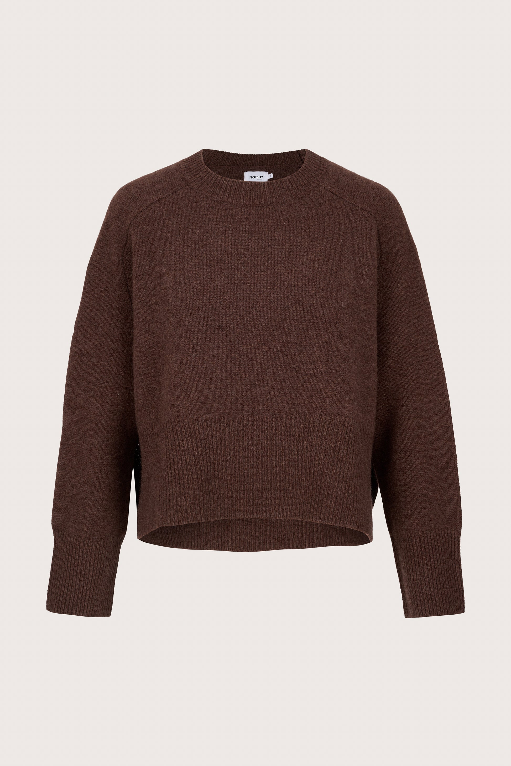 Cashmere Brown sweater on a beige background
