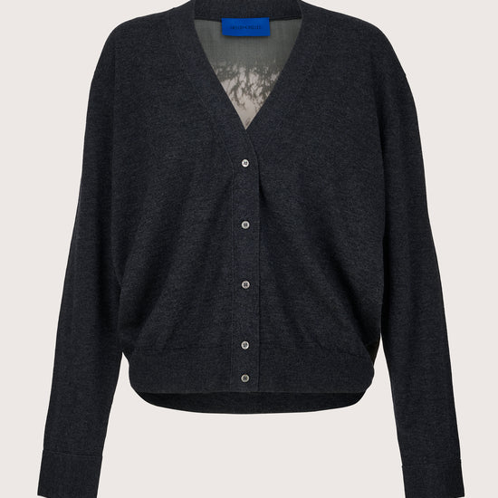 Charcoal cardigan with silk back panel on a light gray background