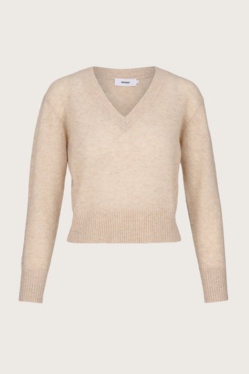 Lightweight cashmere Beige sweater on a light beige background