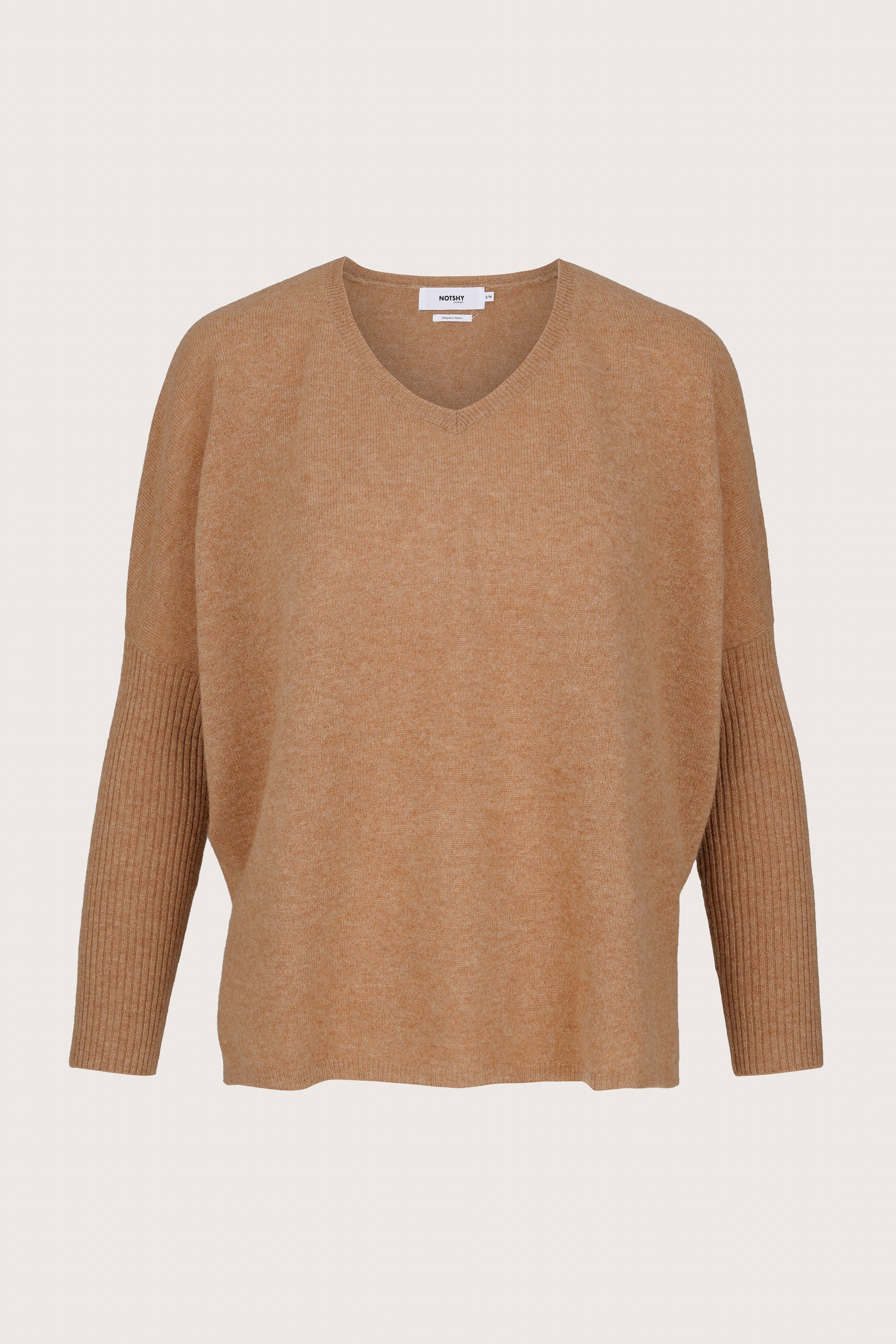 Cashmere Brown sweater on a beige background