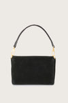 Black handbag with gold chain on a light gray background