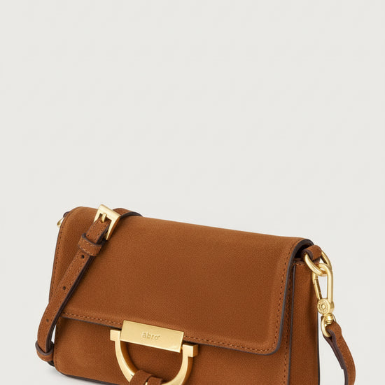 tan suede handbag with removable straps