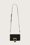 Black handbag with gold accents on a light gray background